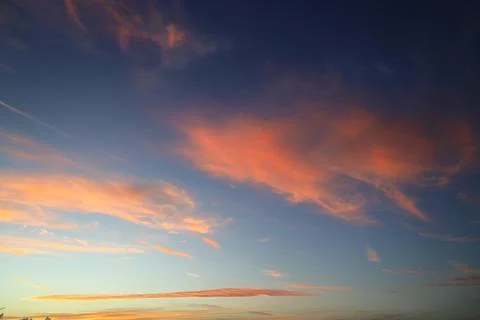 Blurry background of red sunset sky. Dramatic sky with colorful cloud backg.. Stock Photos