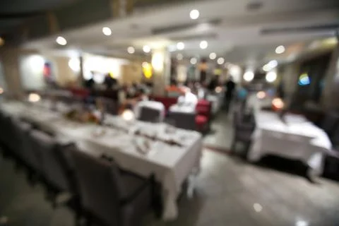 Blurry background of restaurant with bokeh of light. Stock Photos