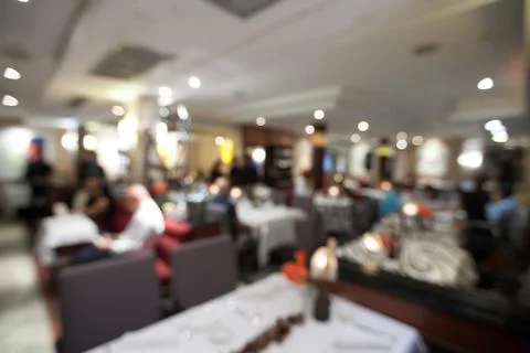 Blurry background of restaurant with bokeh of light. Stock Photos