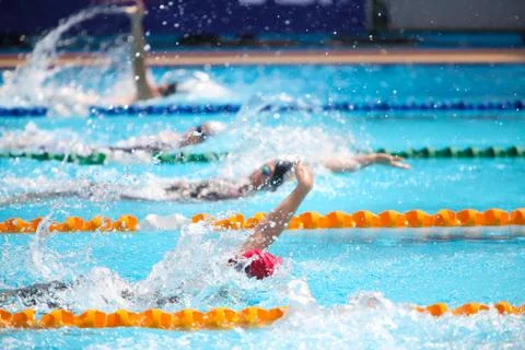 Blurry background of splash drop water on swimming race with swimming competi Stock Photos