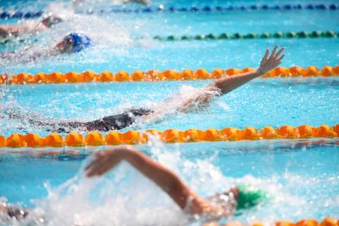 Blurry background of splash drop water on swimming race with swimming competi Stock Photos