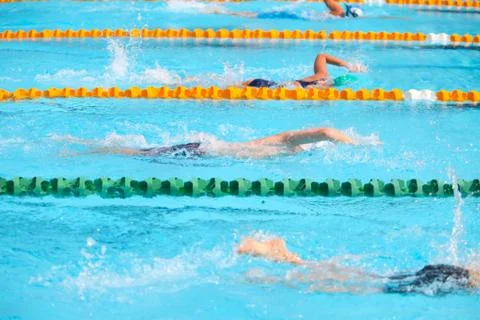 Blurry background of splash drop water on swimming race with swimming competi Stock Photos