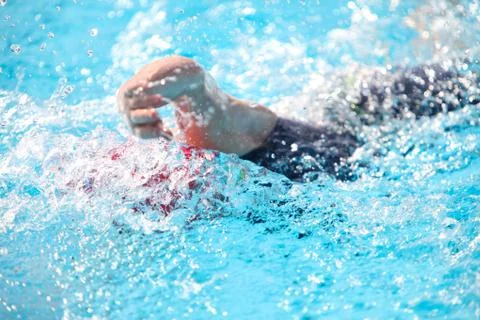 Blurry background of splash drop water on swimming race with swimming competi Stock Photos