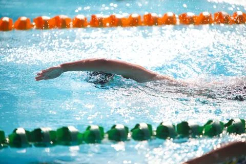 Blurry background of splash drop water on swimming race with swimming competi Stock Photos