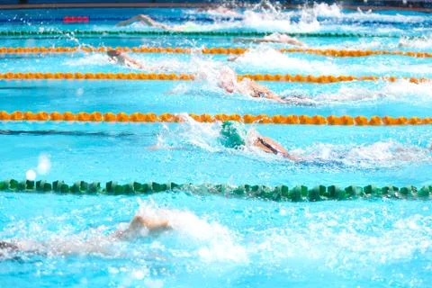 Blurry background of splash drop water on swimming race with swimming competi Stock Photos