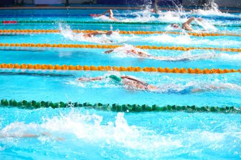 Blurry background of splash drop water on swimming race with swimming competi Stock Photos