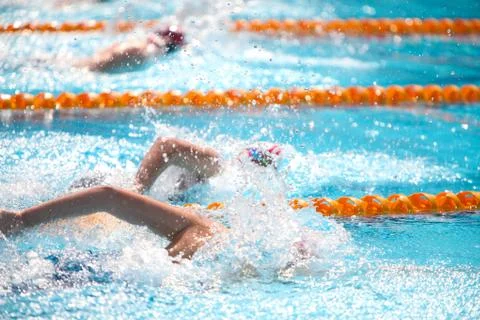 Blurry background of splash drop water on swimming race with swimming competi Stock Photos
