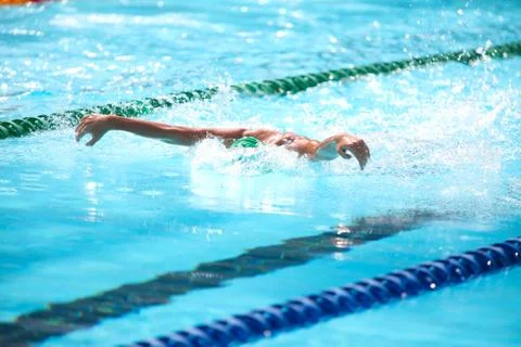 Blurry background of splash drop water on swimming race with swimming competi Stock Photos