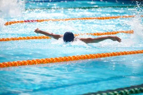 Blurry background of splash drop water on swimming race with swimming competi Stock Photos