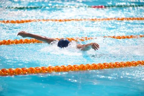 Blurry background of splash drop water on swimming race with swimming competi Stock Photos