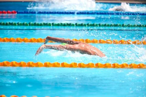 Blurry background of splash drop water on swimming race with swimming competi Stock Photos