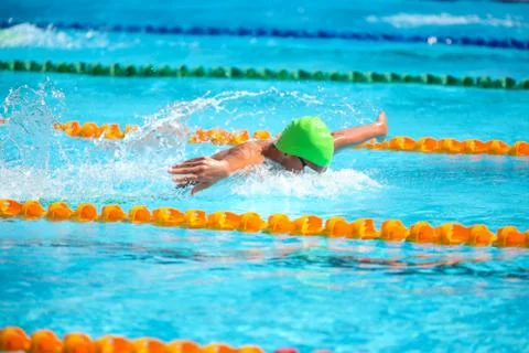 Blurry background of splash drop water on swimming race with swimming competi Stock Photos