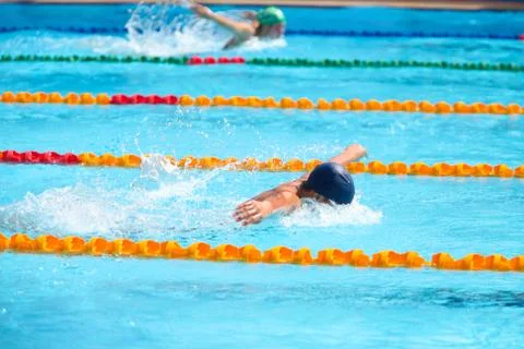 Blurry background of splash drop water on swimming race with swimming competi Stock Photos