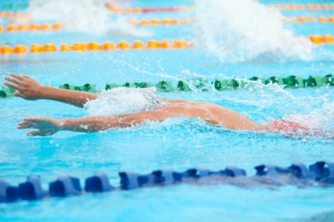 Blurry background of splash drop water on swimming race with swimming competi Stock Photos