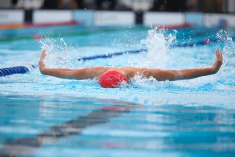 Blurry background of splash drop water on swimming race with swimming competi Stock Photos