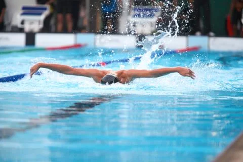 Blurry background of splash drop water on swimming race with swimming competi Stock Photos