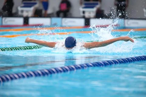 Blurry background of splash drop water on swimming race with swimming competi Stock Photos