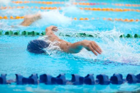Blurry background of splash drop water on swimming race with swimming competi Stock Photos