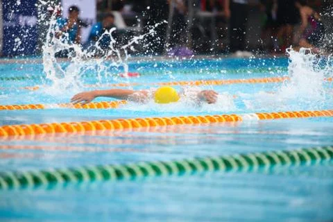 Blurry background of splash drop water on swimming race with swimming competi Stock Photos