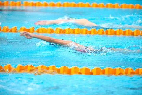 Blurry background of splash drop water on swimming race with swimming competi Stock Photos