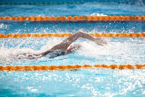Blurry background of splash drop water on swimming race with swimming competi Stock Photos