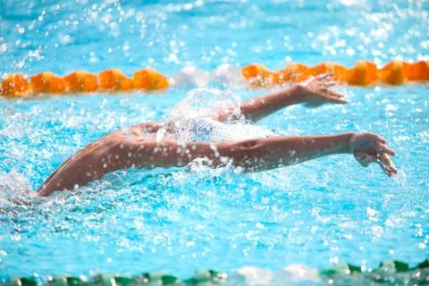 Blurry background of splash drop water on swimming race with swimming competi Stock Photos