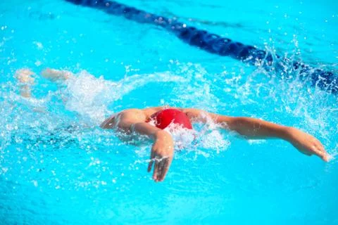 Blurry background of splash drop water on swimming race with swimming competi Stock Photos