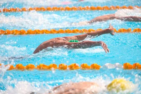 Blurry background of splash drop water on swimming race with swimming competi Stock Photos