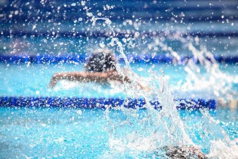 Blurry background of splash drop water on swimming race. Stock Photos