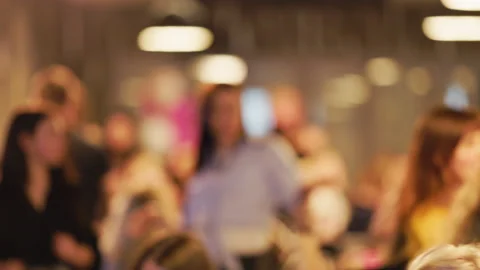 Blurry background: Startup pitch celebration, indoor conference, slow motion Stock Footage 332357509