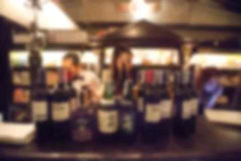 Blurry background of whisky bar and restaurant with vintage tone. Stock Photos
