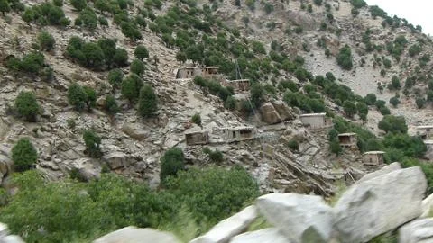 Blurry big boulders with rows of trees on the hills Stock Photos