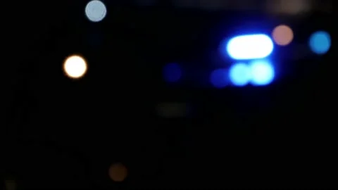 Blurry blinking blue lights reflection of police ship on the river Stock Footage 136240832