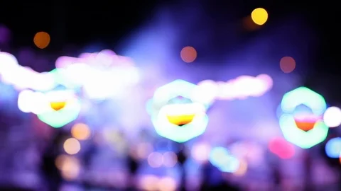 Blurry blinking lights of carousel ride at night Stock Footage 123705759
