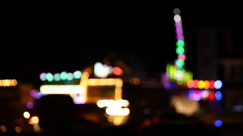 Blurry blinking lights of faiground attractions at night Stock Footage 123705842