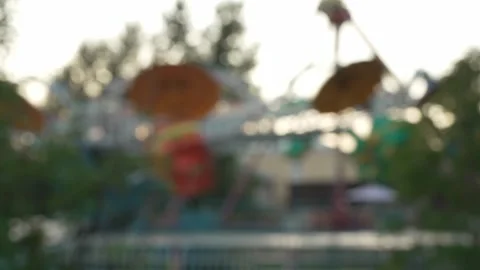 Blurry bokeh background of carousel ride in an amusement park. Stock Footage 341136593