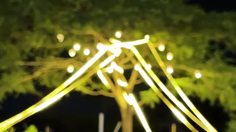 Blurry bokeh lights glowing on tree at night background Stock Footage 340581008