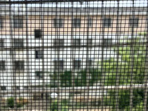 Blurry Building View Through Window Mesh Screen Stock Photos