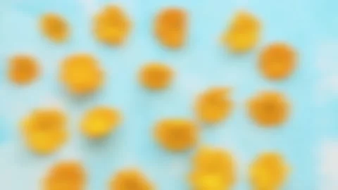 Blurry calendula on a blue background Stock Footage 136933109