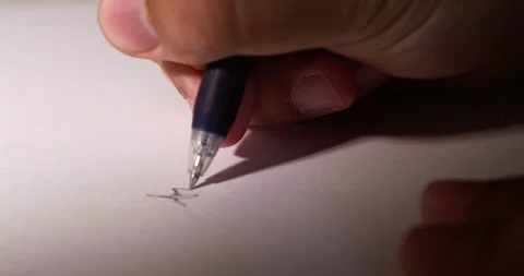 Blurry close-up of an individual's hand while scribbling some notes using Stock Footage 278144224