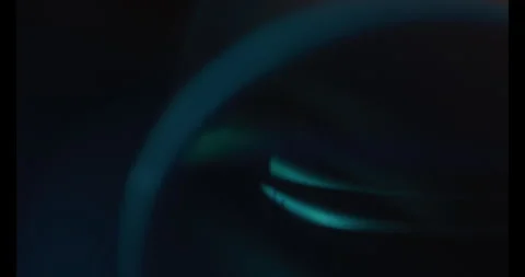 Blurry Close up Pan of a Camera Lens Видео 270396013