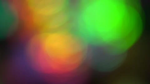 Blurry colored circles rotate. for the background. Slow motion Stock Footage 132859644