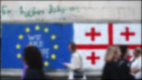Blurry copy space banner background Georgian and EU Flag on wall with writt.. Stock Footage 277866982