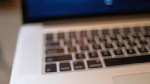 Blurry, defocus, out focus of a cup of cappuccino coffee with laptop Stock Footage 98979784