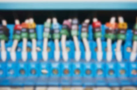 Blurry electrical wires connected to the numbered relays. Stock Photos