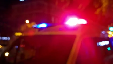 Blurry emergency lights background video, rack focus. 스톡 동영상 317230266