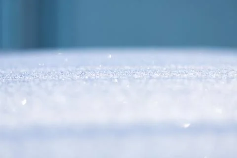 Blurry flicker of the snow surface as a background Fotos de archivo
