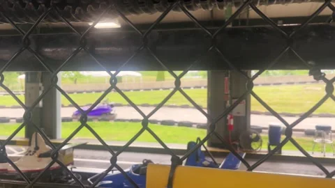 Blurry Go Carts on Amusement Park Track - Cinematic Filler Shot - ALT Stock Footage 336504701