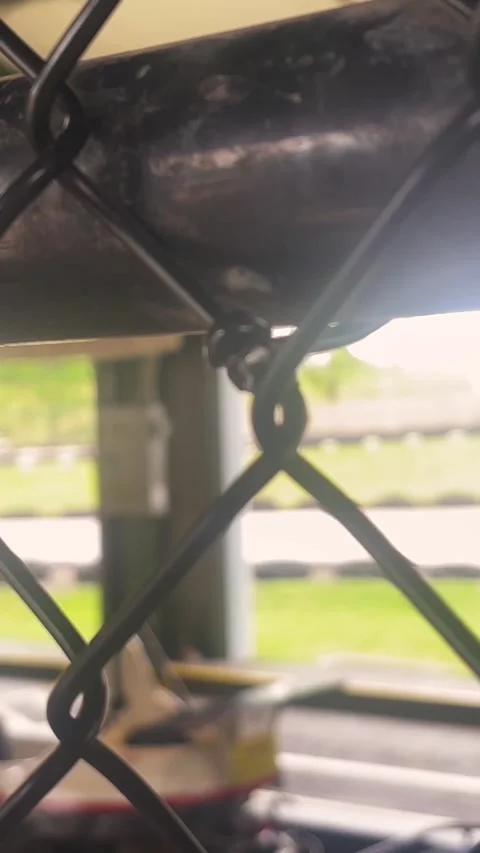 Blurry Go Carts on Amusement Park Track - Cinematic Filler Shot - Vertical Stock Footage 336504702