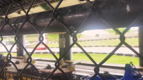 Blurry Go Carts on Amusement Park Track - Cinematic Filler Shot Stock Footage 336504740